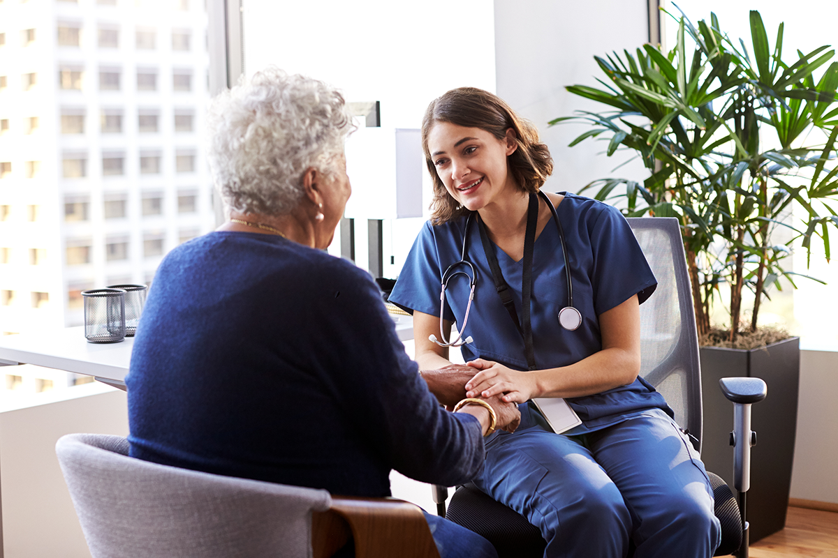 Patient and doctor talking in office
