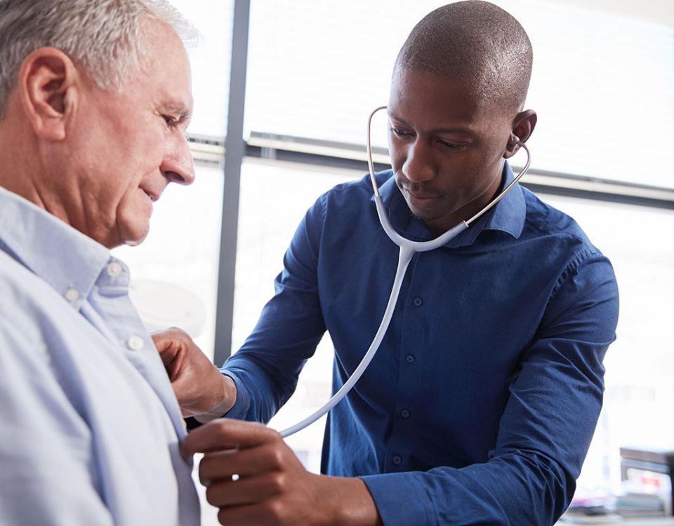 Doctor listening to patient's lungs