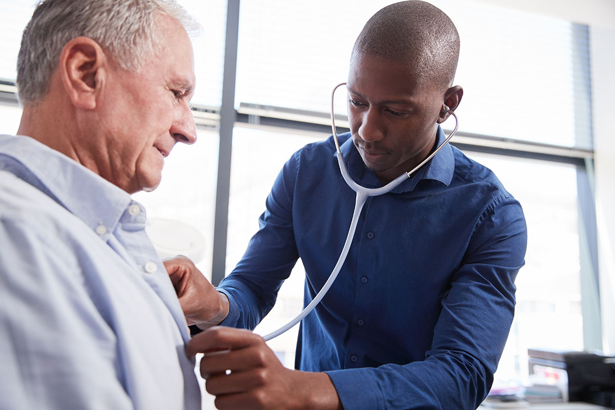 Doctor listening to patient's lungs
