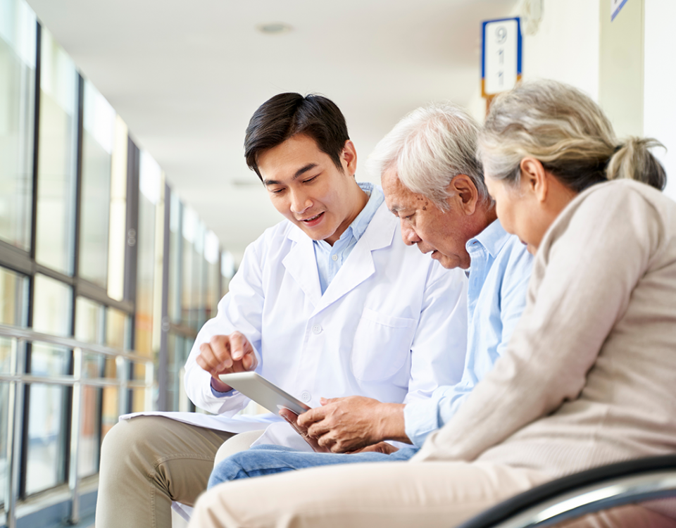 Doctor speaking with couple