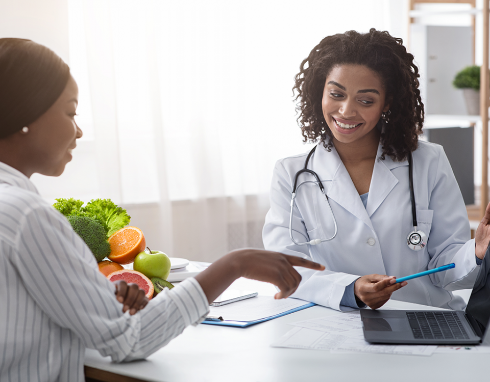 Young patient and doctor with laptop