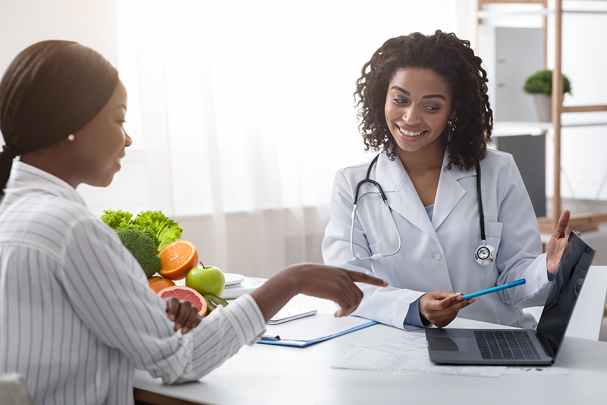 Young patient and doctor with laptop