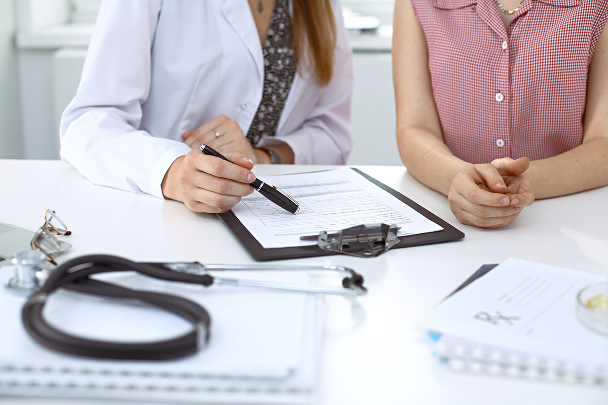 Doctor and patient completing survey