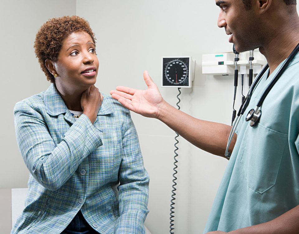 Woman talking with doctor