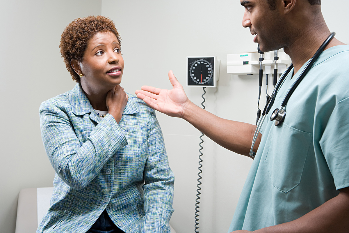 Woman talking with doctor