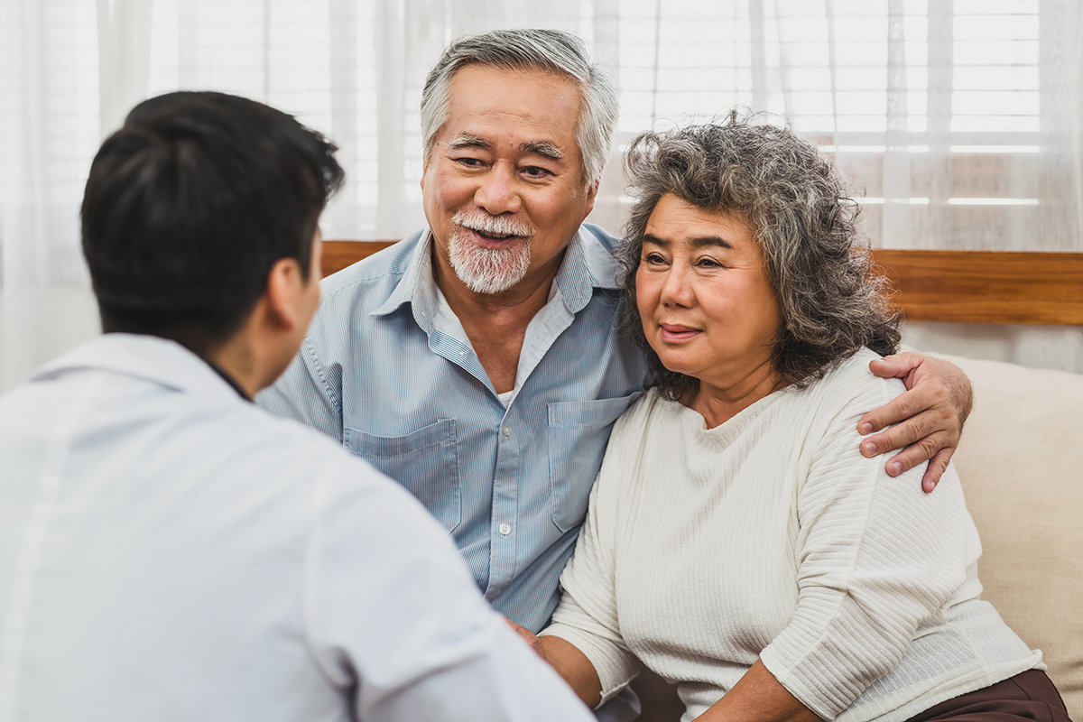 Couple speaking to doctor