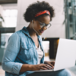 Young Black woman on laptop