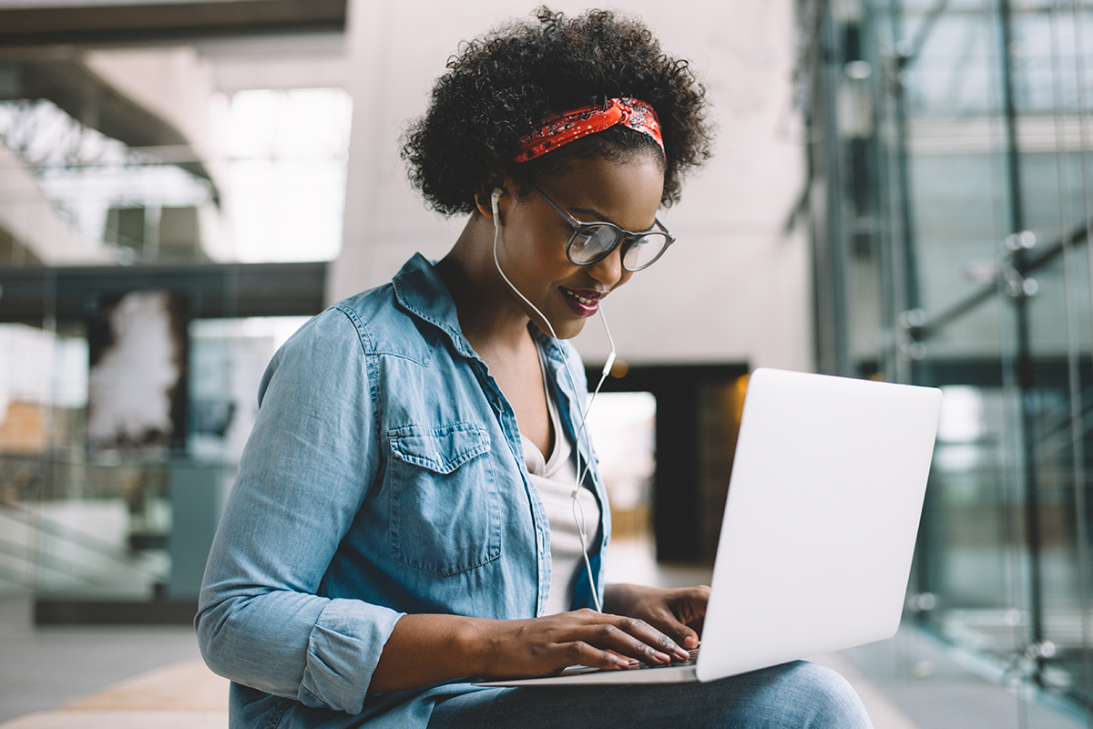 Young Black woman on laptop